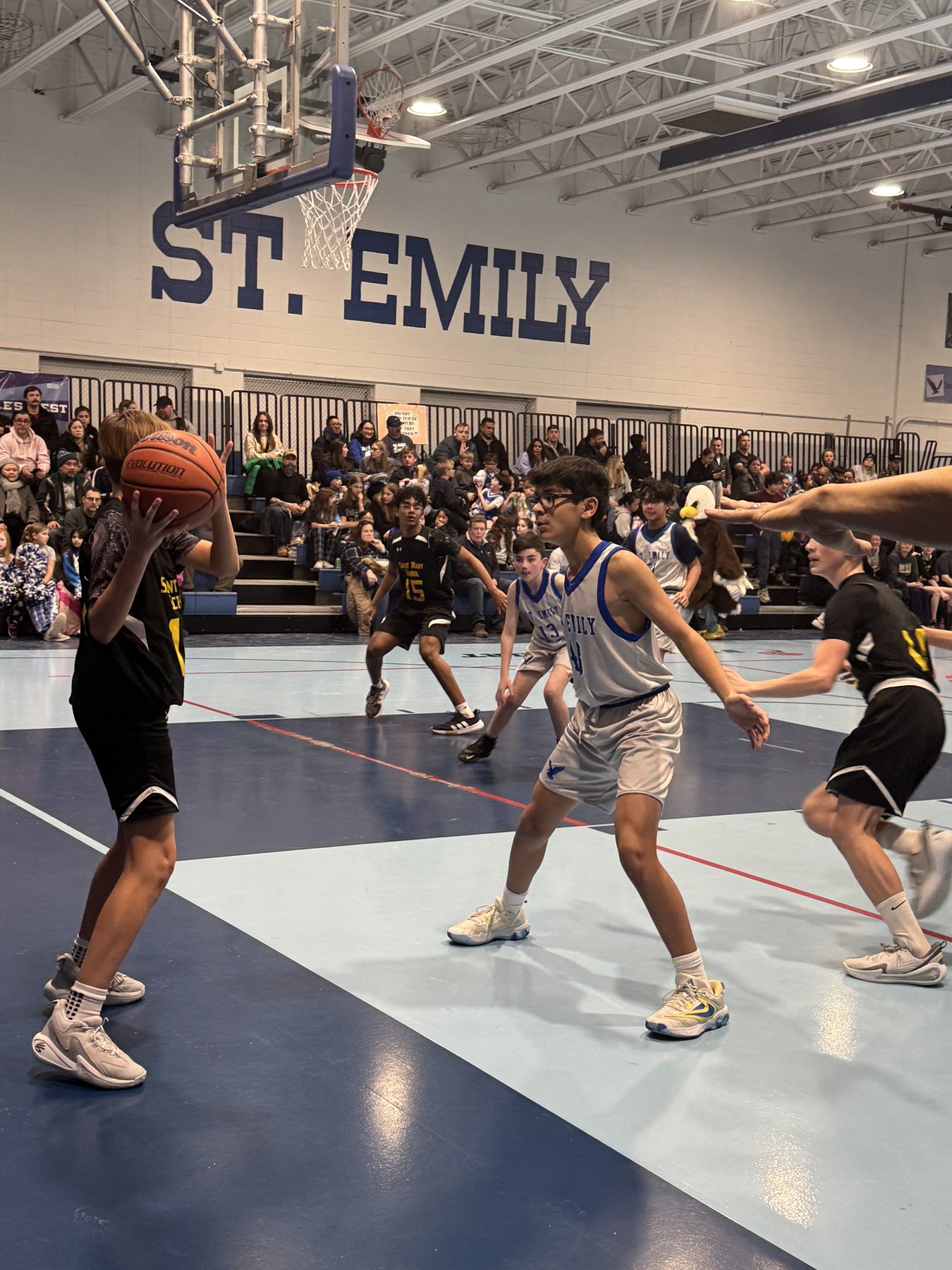St. Emily Eagles basketball game action